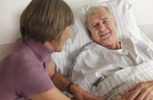 Senior Patient in Hospital Bed